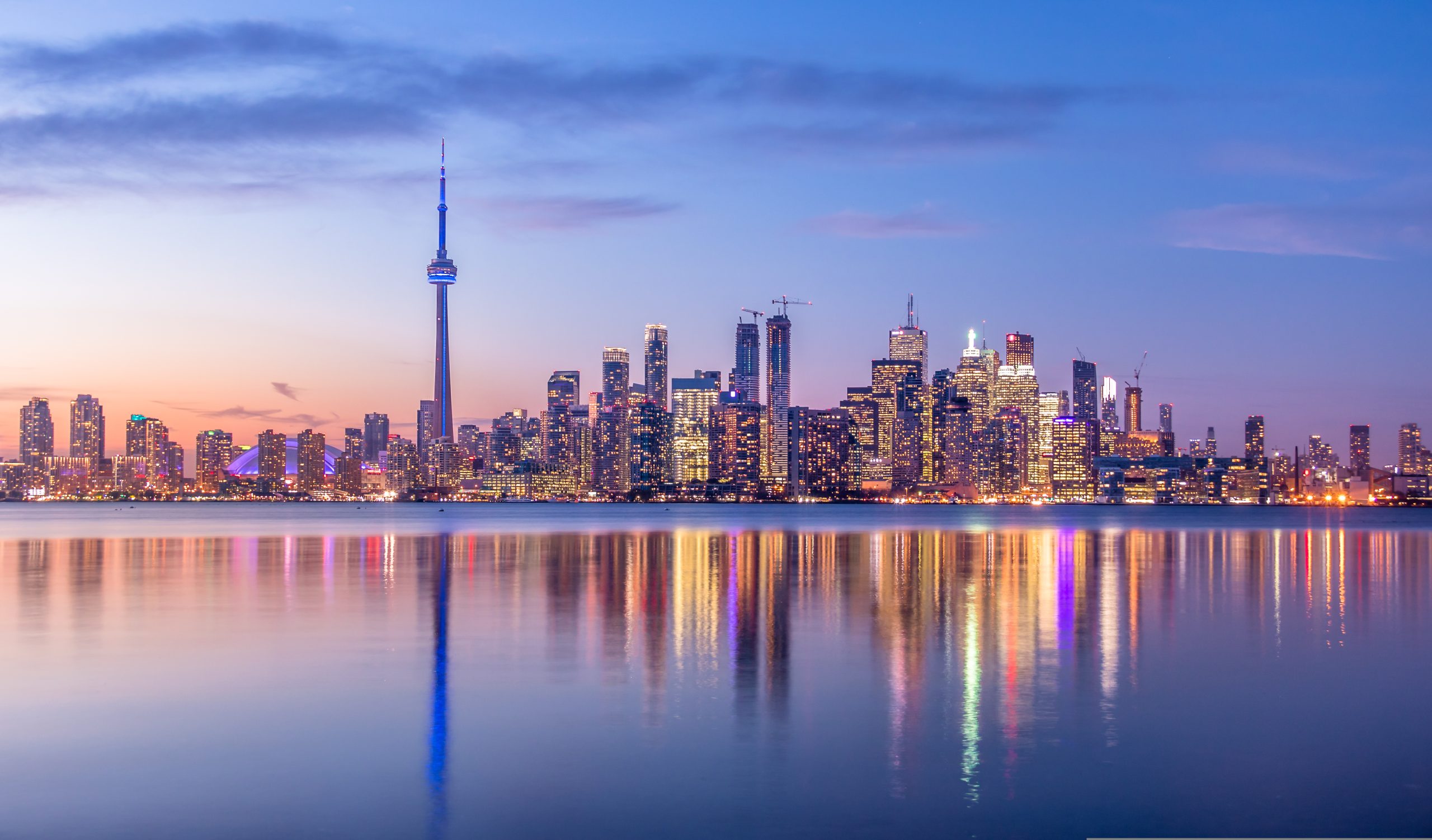 Toronto,Skyline,With,Purple,Light,-,Toronto,,Ontario,,Canada
