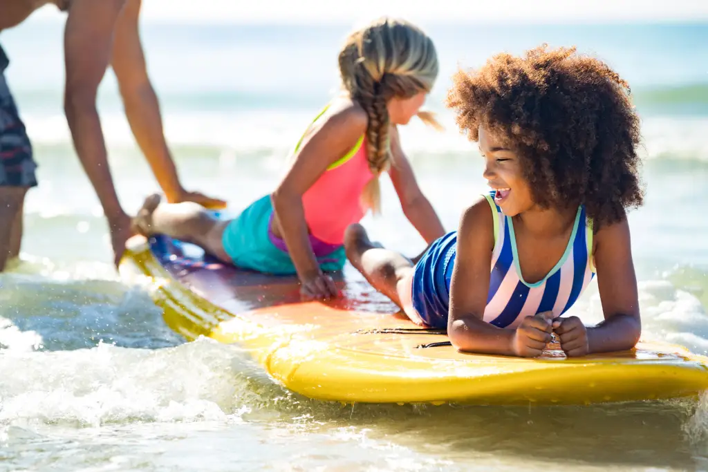 Naples Girls on Paddleboard at the Beach